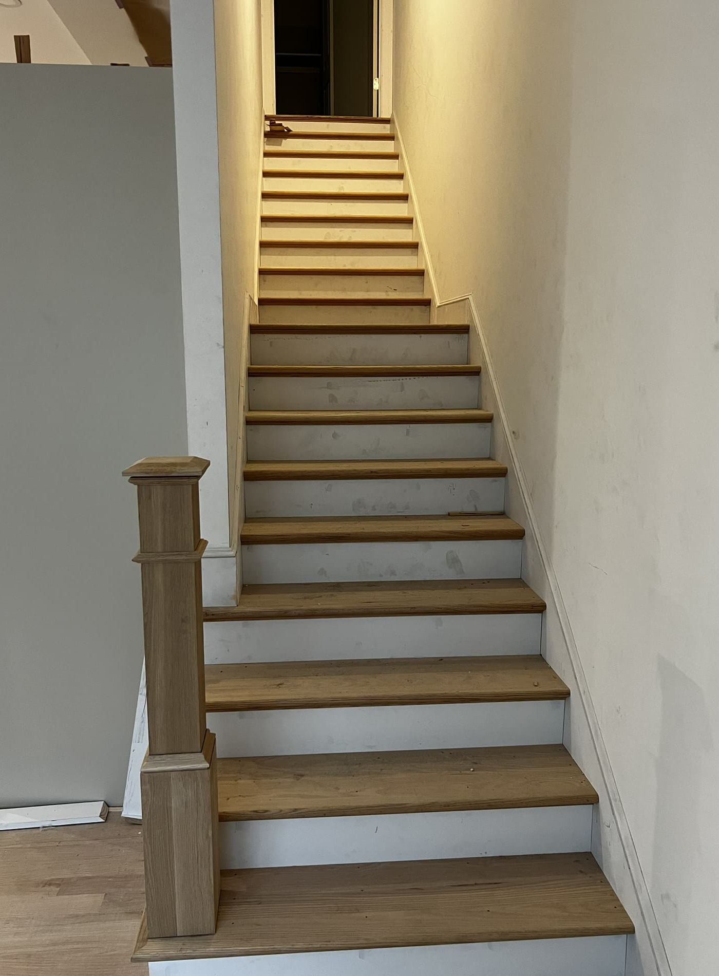 New white oak staircase with oak treads, newel post and handrail