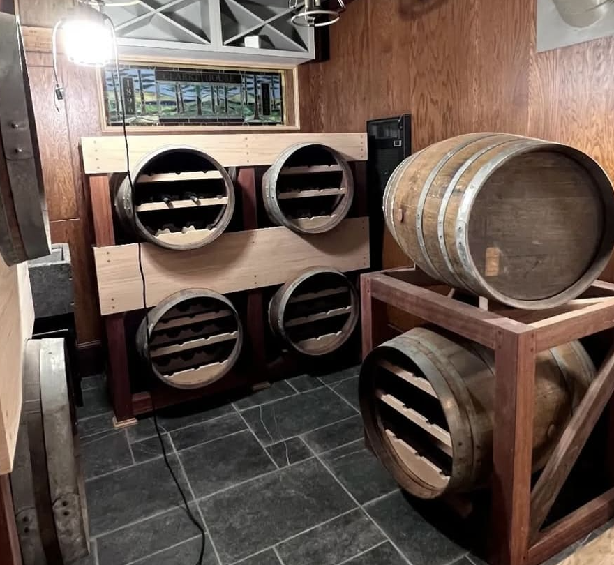 Mahogany wine cellar with barrel-end racks